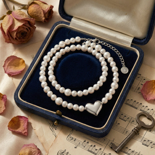 Timeless Pearl Necklace with Heart-Shaped Silver Pendant